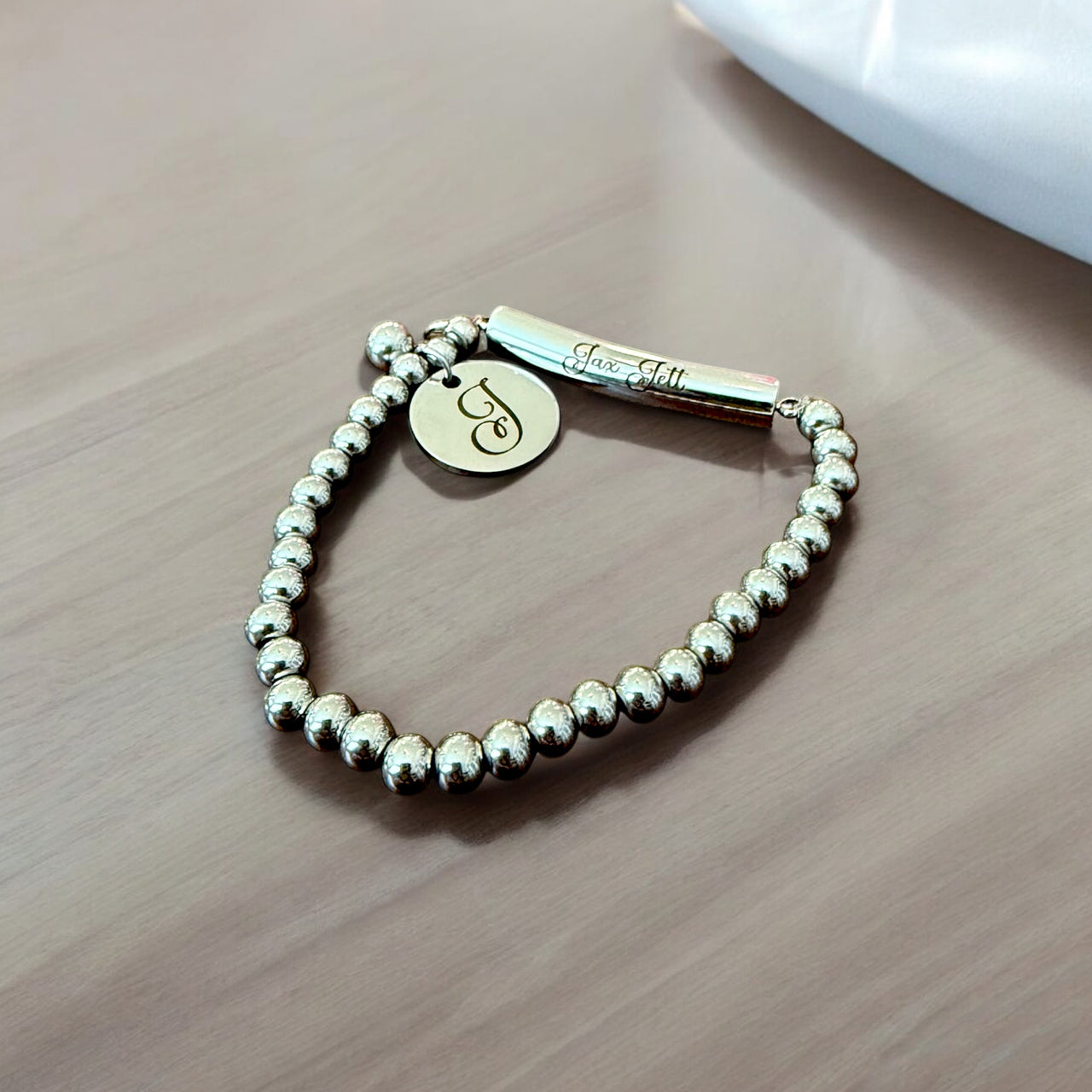 Personalized beaded bracelet with charm