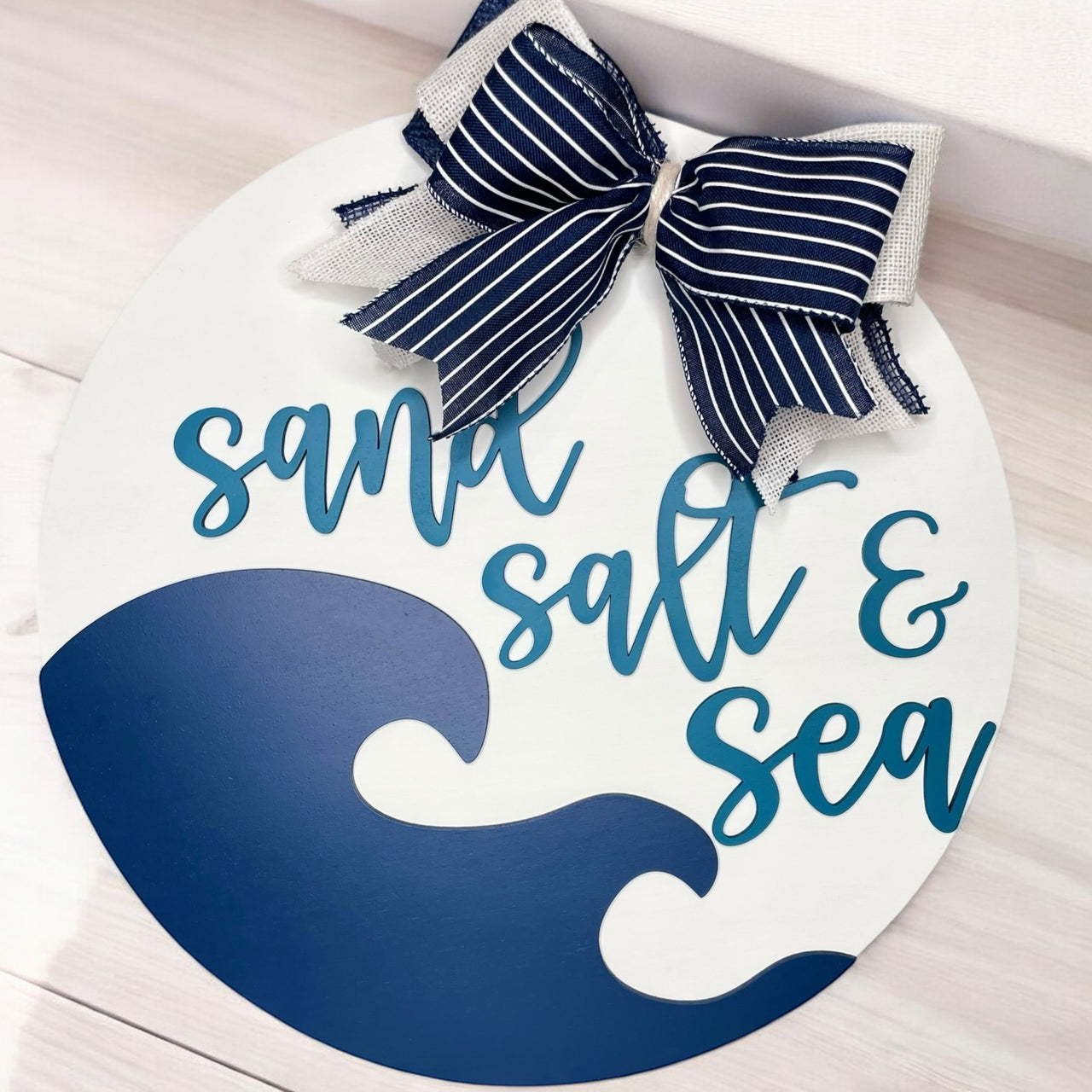 Sand salt and sea welcome sign