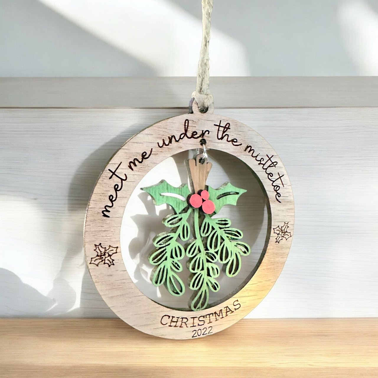 Under the mistletoe ornament, present, decor, Christmas